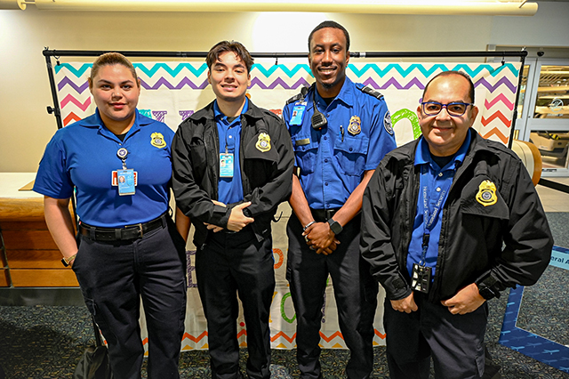 2025 Federal Airport Employee Appreciation Day photo of four federal TSA agents standing next to each other.
