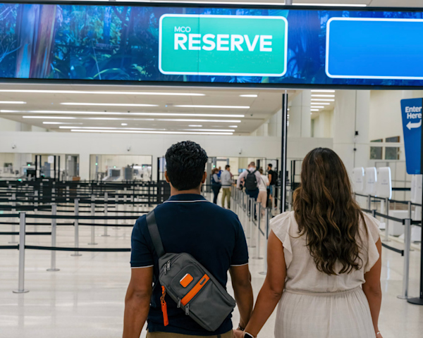 A couple walking towards MCO Reserve.