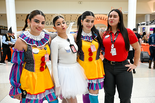 2025 Halloween at MCO photo of four ladies dressed up in costume.