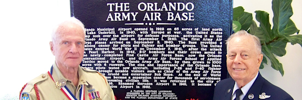 In 2010, two veterans stand in front of dedicated State Historical Marker, recognizing the contributions that the airport made in support of World War II. The marker is located at the northeast corner of the intersection of Maguire Blvd. and Livingston St. on the west side of the airport.