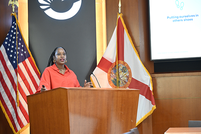CSAC Culture Team - WORKSHOP Learn and Grow - Compassion Fatigue photo of woman speaker at a podium.