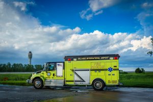 ARFF fire paramedics vehicle with GOAA tower in the background.