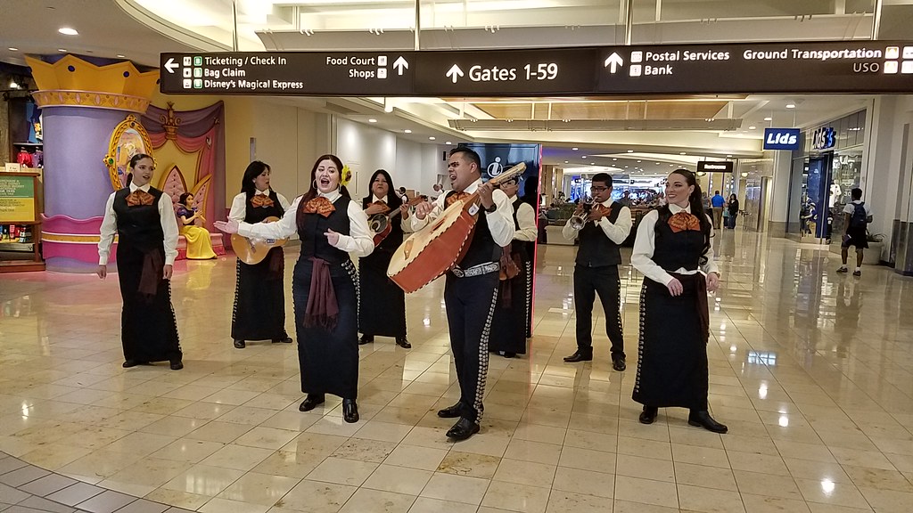 Las Aztecas May 2017 playing instruments in a terminal at MCO.