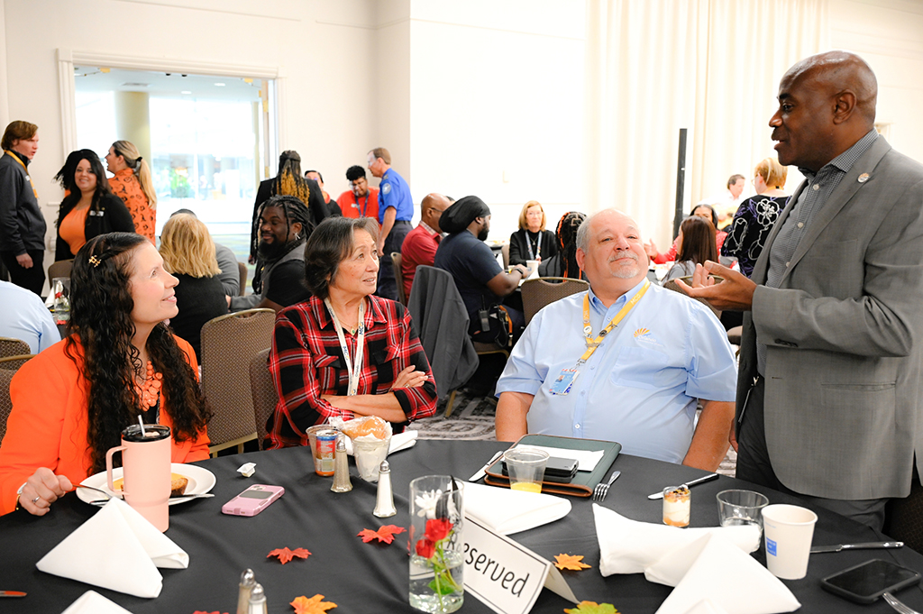 2025 Employee Recognition Brunch group photo with Lance Lyttle speaking to the group.