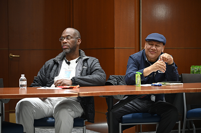 CSAC Culture Team - WORKSHOP Learn and Grow - Compassion Fatigue photo of two men at a boardroom table listening intently to a speaker.
