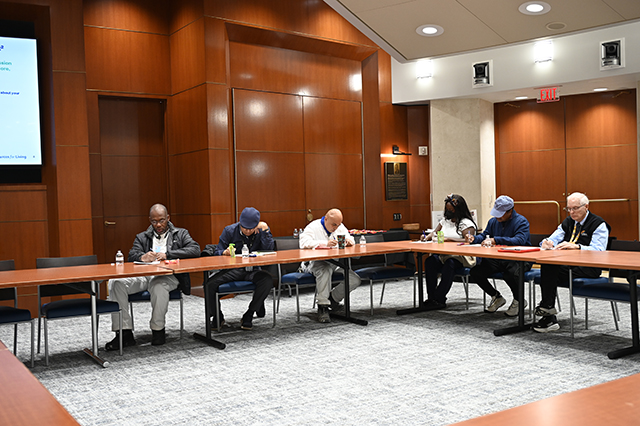 CSAC Culture Team - WORKSHOP Learn and Grow - Compassion Fatigue photo of GOAA employees at a table taking notes