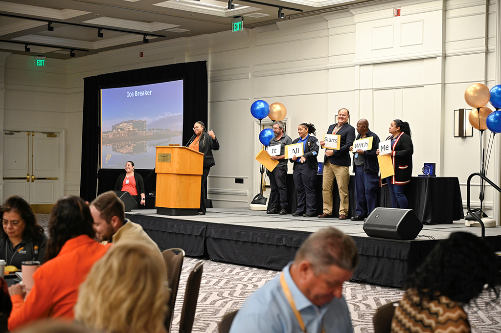 2025 Employee Recognition Brunch photo of employees on stage receiving awards.