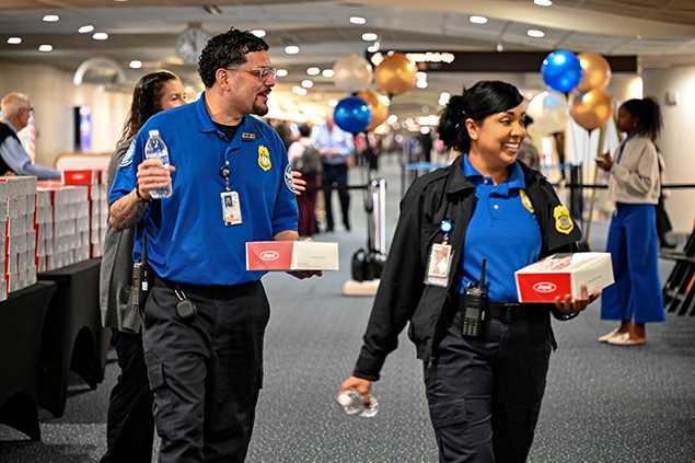 2025 Federal Airport Employee Appreciation Day photo of federal employees receiving a lunch box.