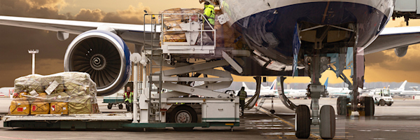 Loading cargo onto an aircraft.