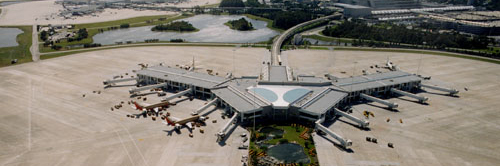 2000 aerial photo of MCO's gates 100 to 129 with planes parked.