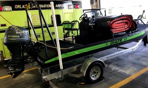 ARFF fire boat, parked inside fire station garage.