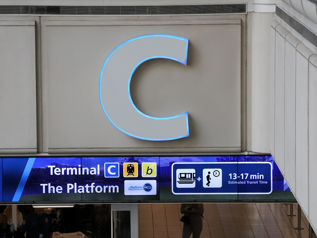 Looking up at a wall showing Terminal C.