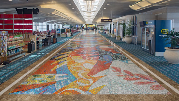 Artist: Victor Bokas
Details: 2000, 15 by 88 feet, Polished natural stone and vitreous ceramic
Collection: GOAA Art Collection
Location: Gates 100-109