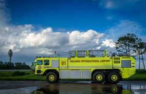 ARFF fire vehicle with GOAA tower in the background.