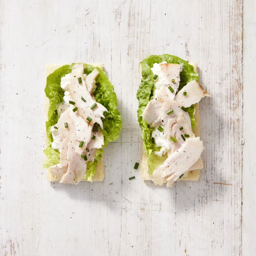 Cruskits with shaved turkey, cottage cheese, cos lettuce and chives