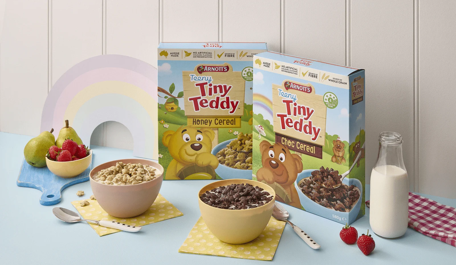 Image of Teeny Tiny Teddy Cereal packs with two bowls, milk and fruit