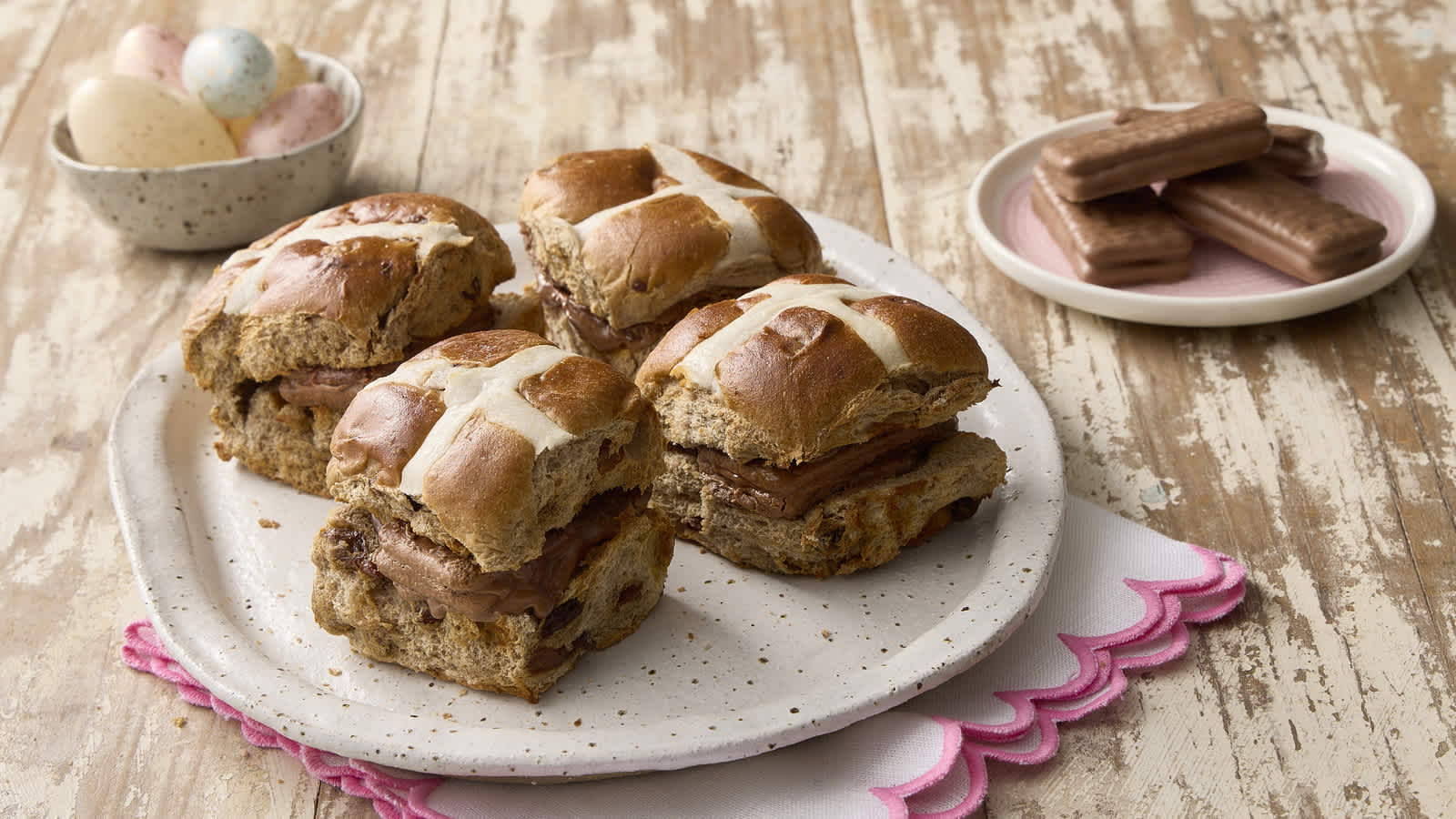 Image of Tim Tam Hot Cross Buns, with plate of Tim Tams