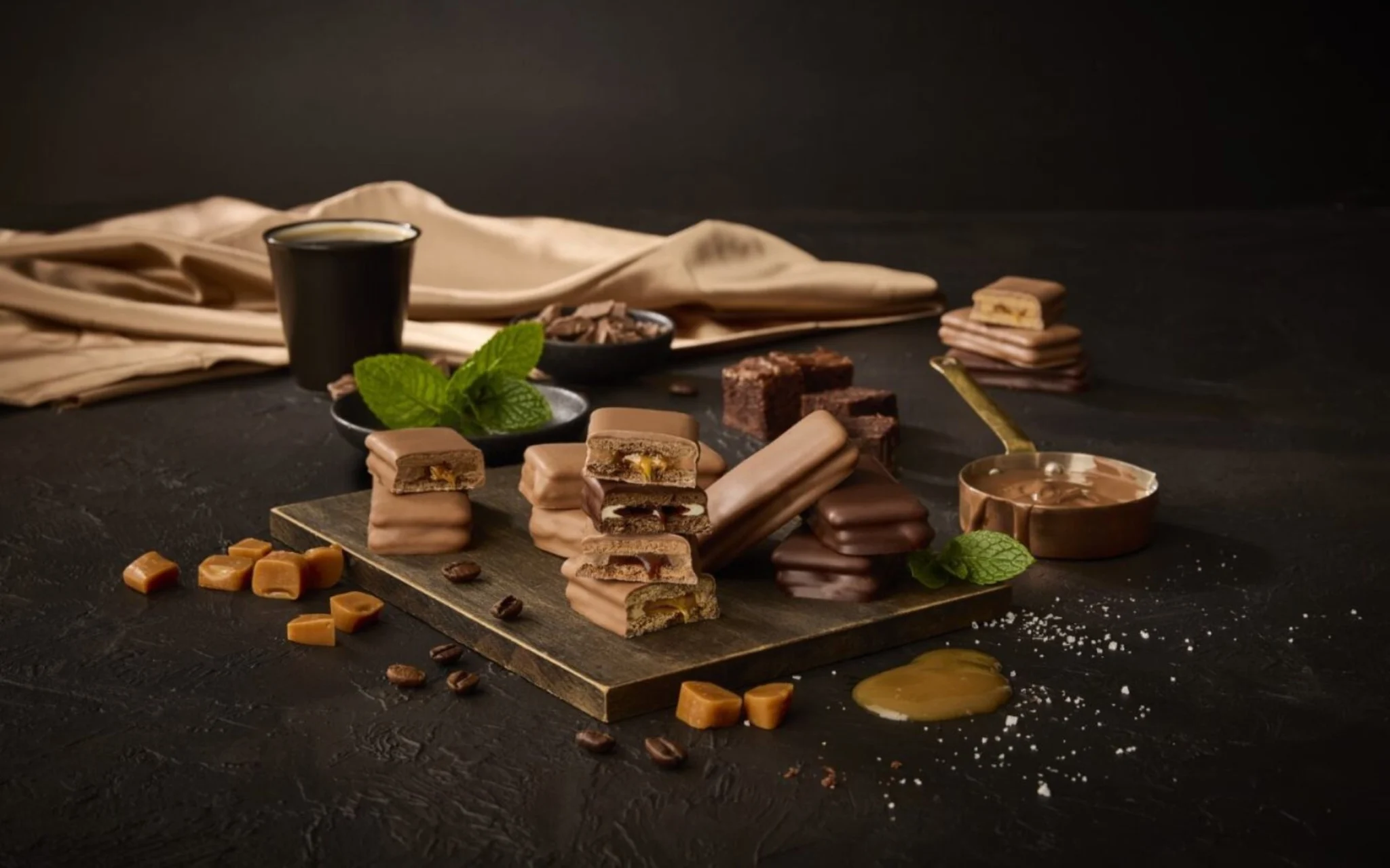 Range of Tim Tam Deluxe biscuits, with various flavour cues