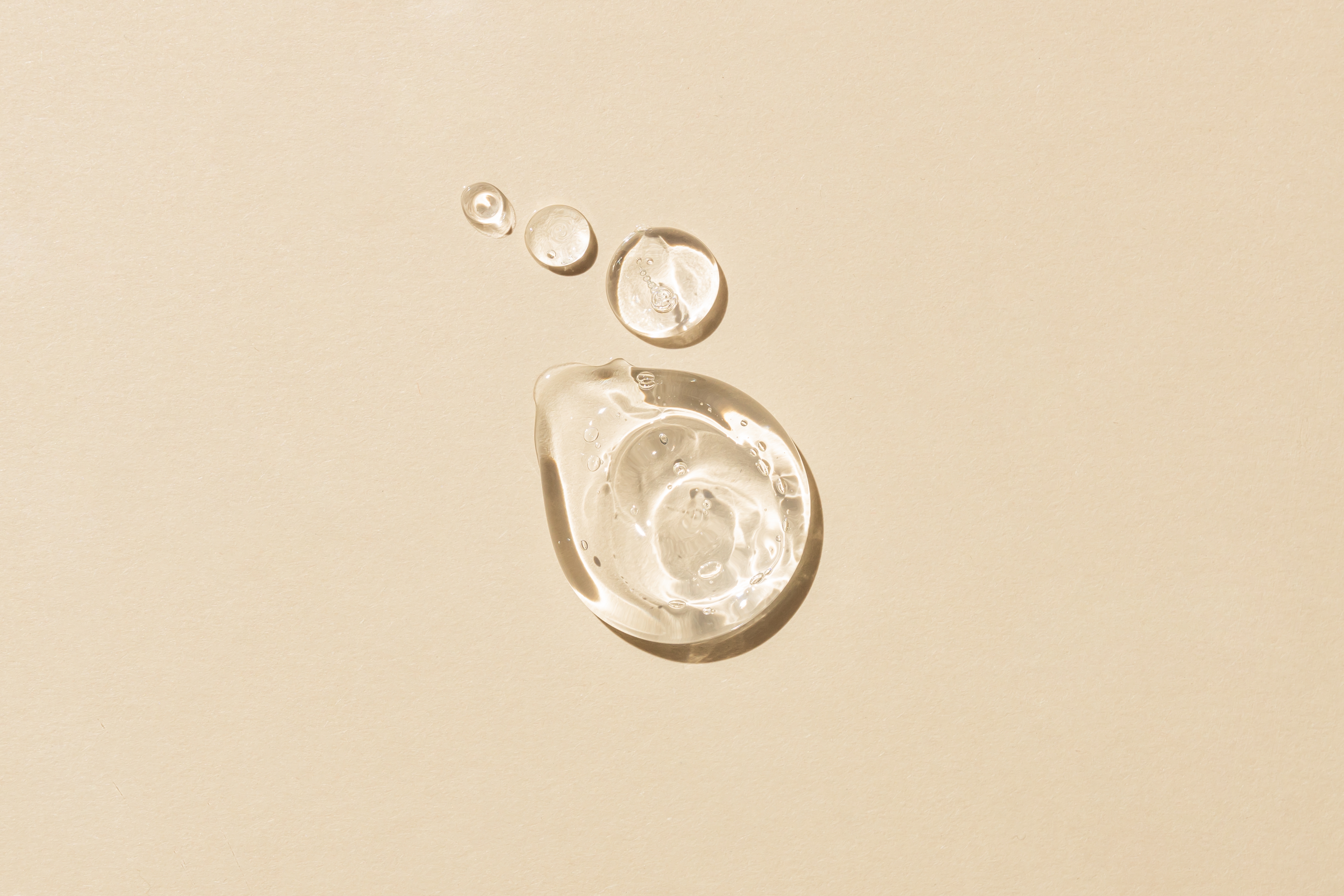 Clear glycerin-inspired transparent droplets on a neutral background