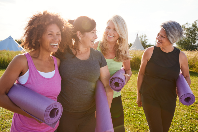 confident women conversing after exercise