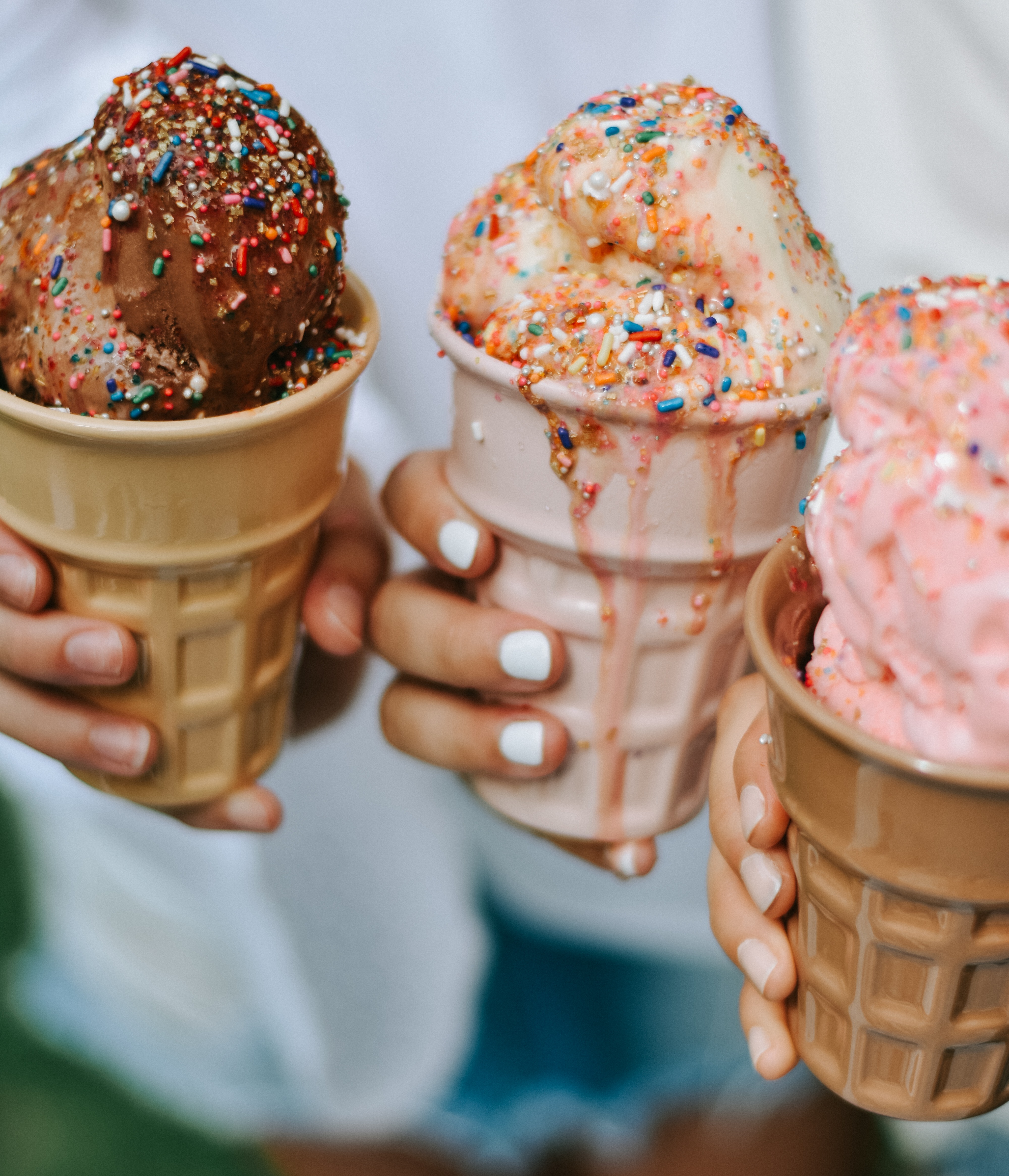 an assortment of ice cream flavours in cones