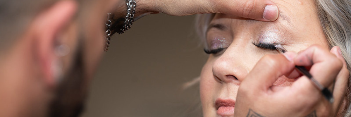 Closeup of artist putting on eyeshadow 