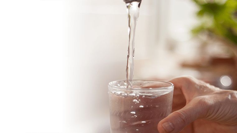 Tab water being poured into a glass