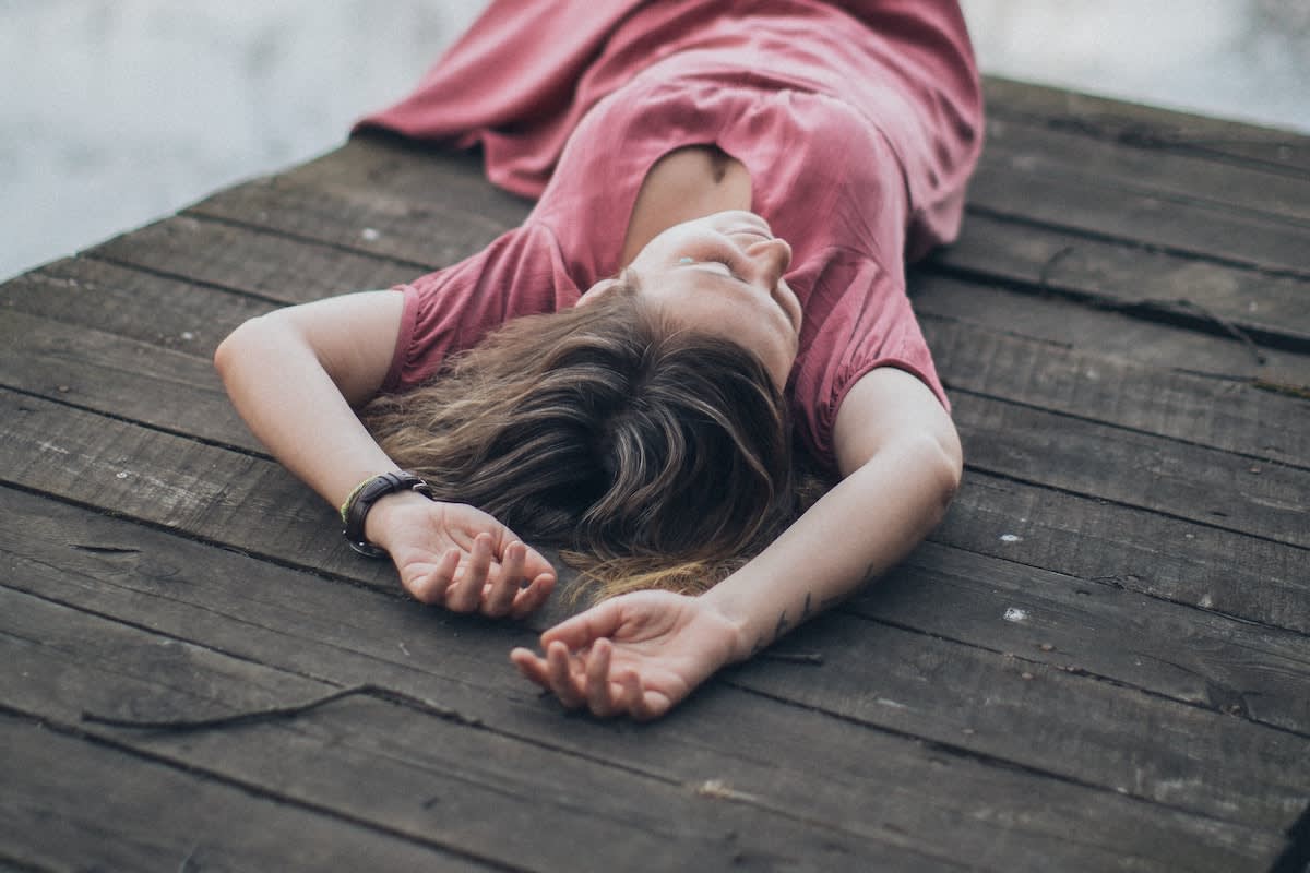 woman lying on a dock