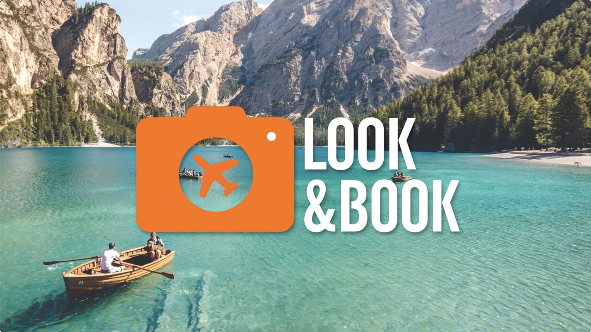 people-on-a-rowing-boat-on-a-river-among-the-mountains.-text-reads-look-and-book