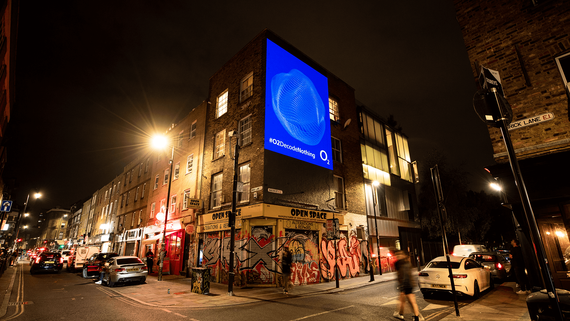 A light billboard with #O2DecodeNothing on it