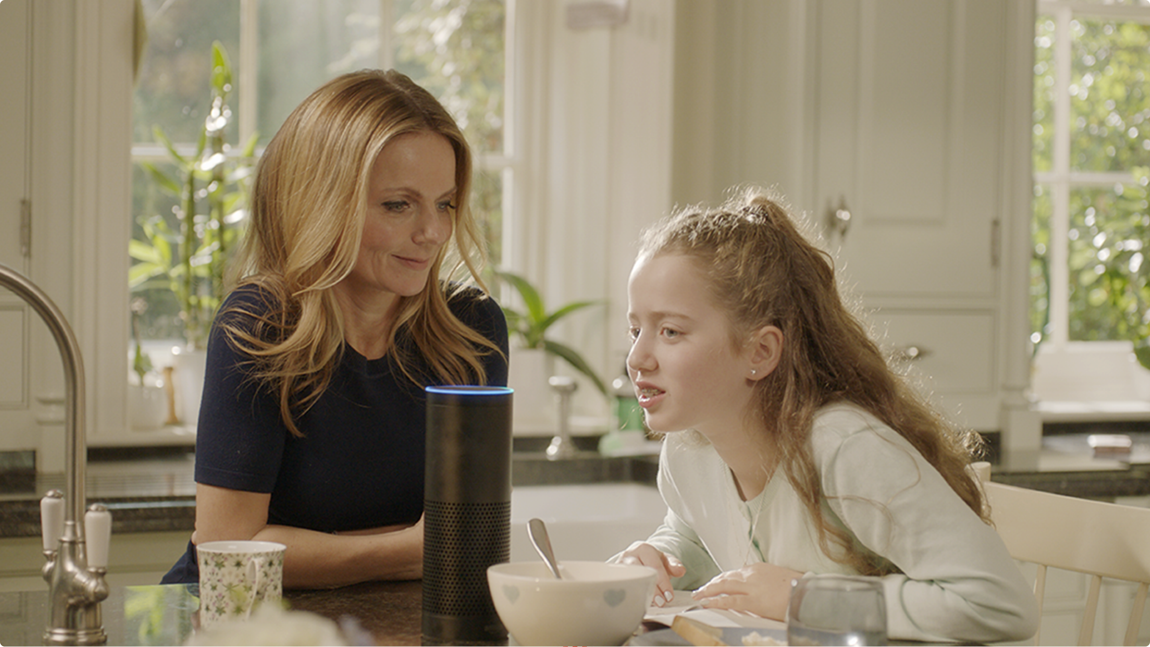 a mother and daughter speaking to Amazon Alexa playing parents versus kids