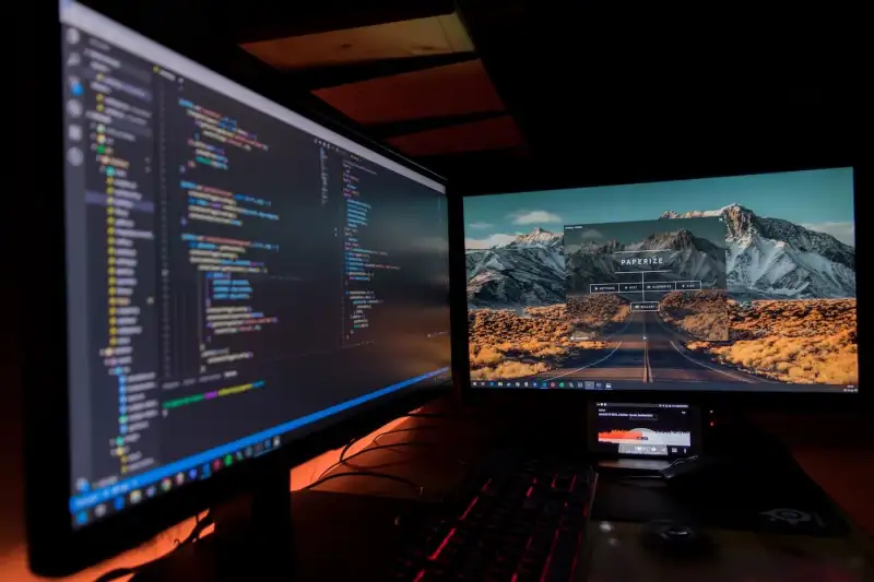 image of two monitors with work open