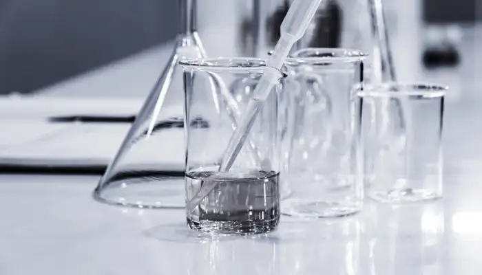 beakers and glassware on a laboratory bench