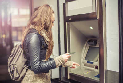 Girl using ATM