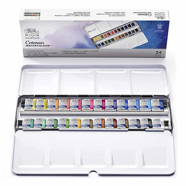 a white palette filled with 24 watercolour paint pans