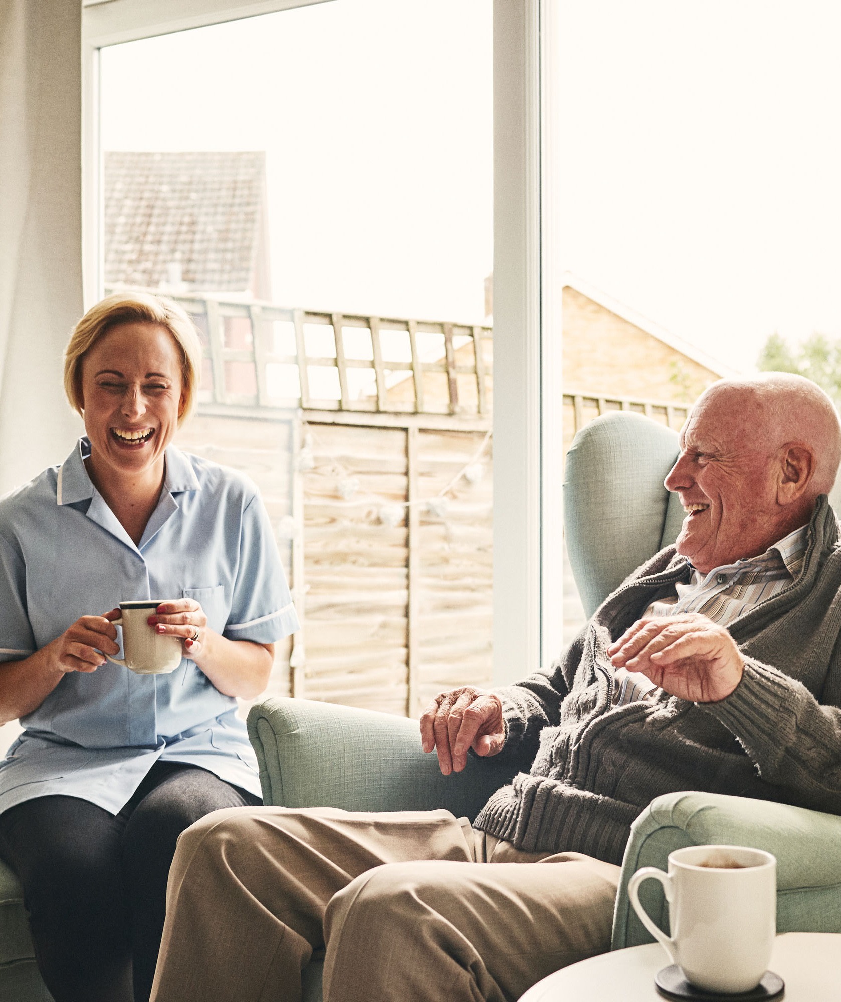 A nurse and a man laughing