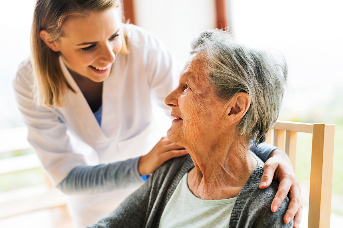 A nurse comforting a patient