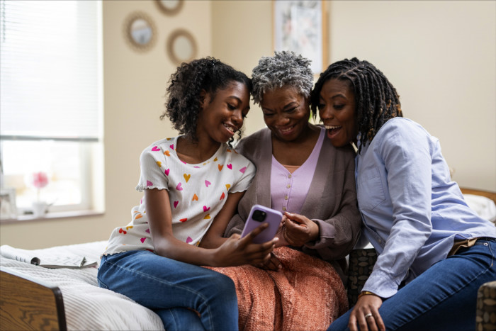 A mom, grandma and daughter visiting together