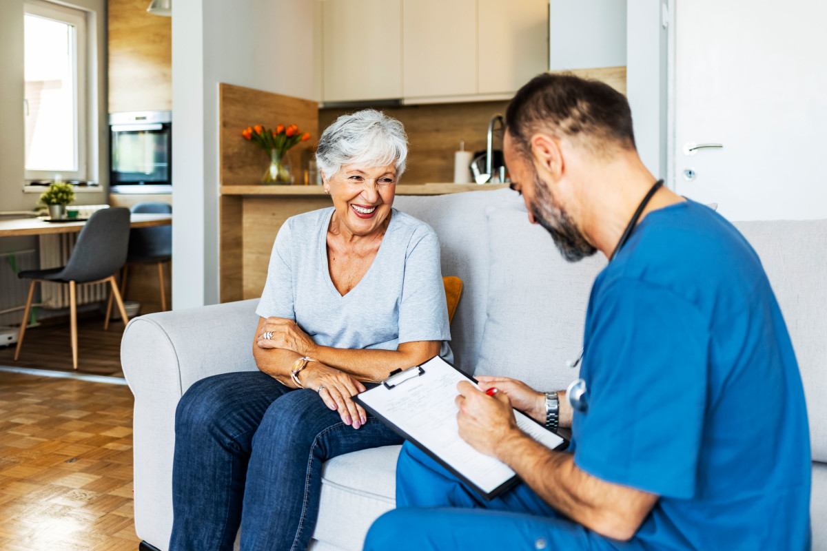 A nurse going through a checklist with a patient