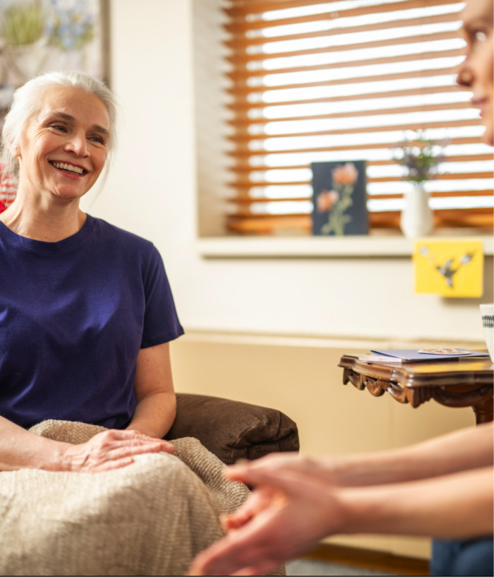 A nurse talking with a resident