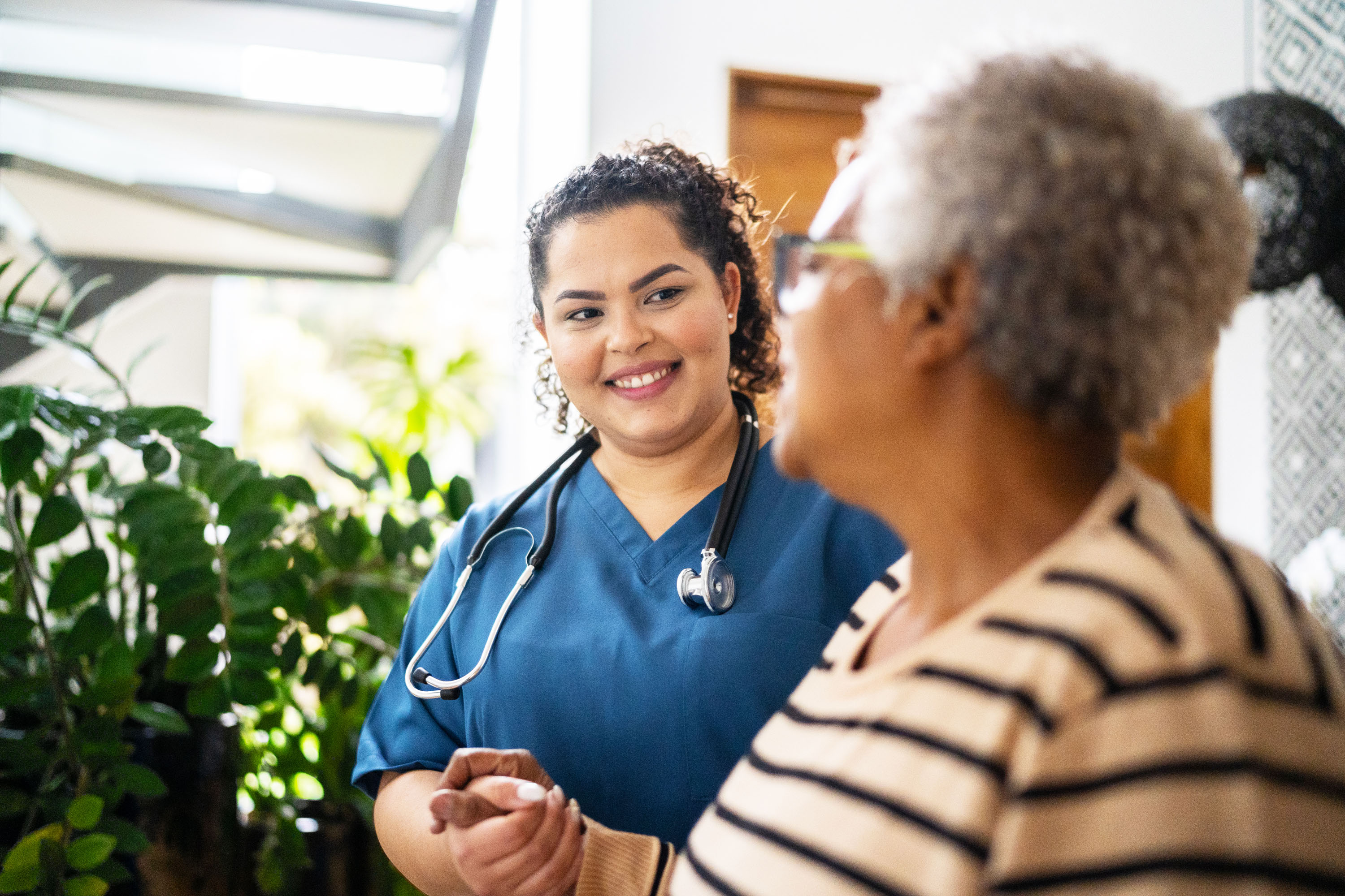 A nursing greeting a woman