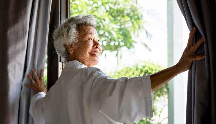 Woman smiling out a window