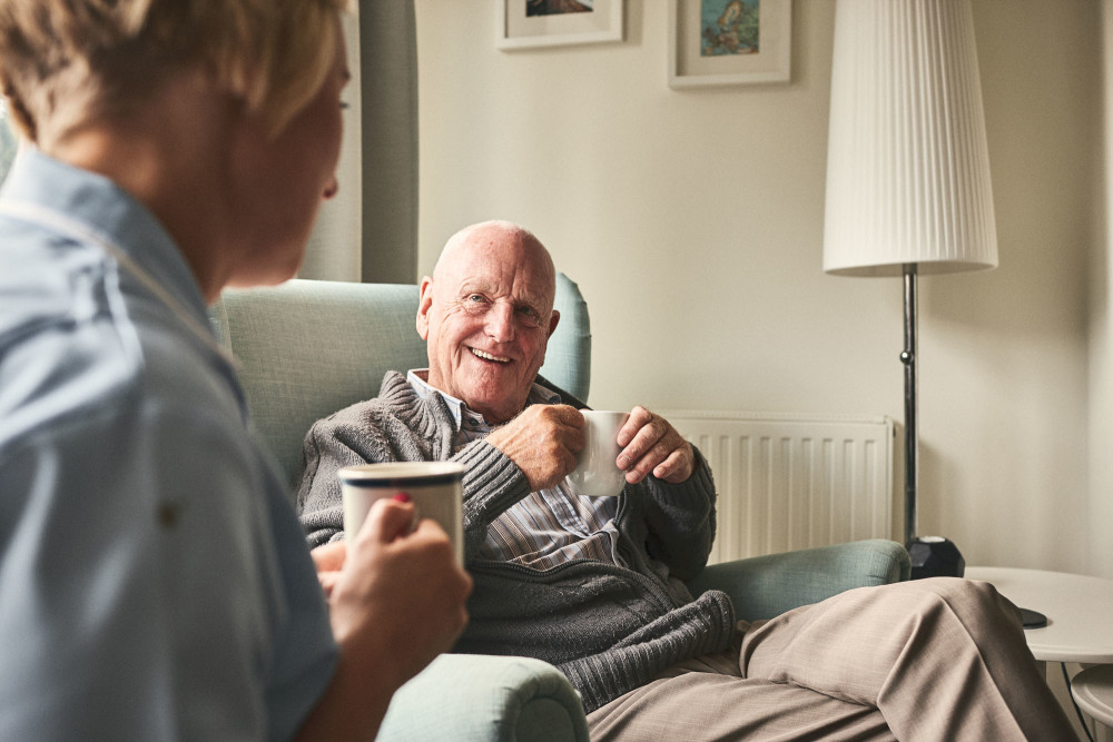 A nurse having coffee with a man