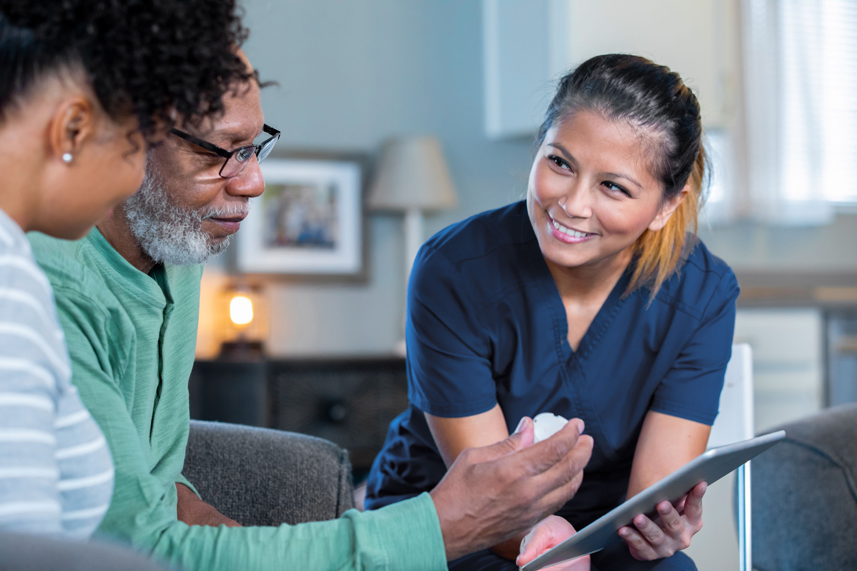 A nurse going through paper work with a patient