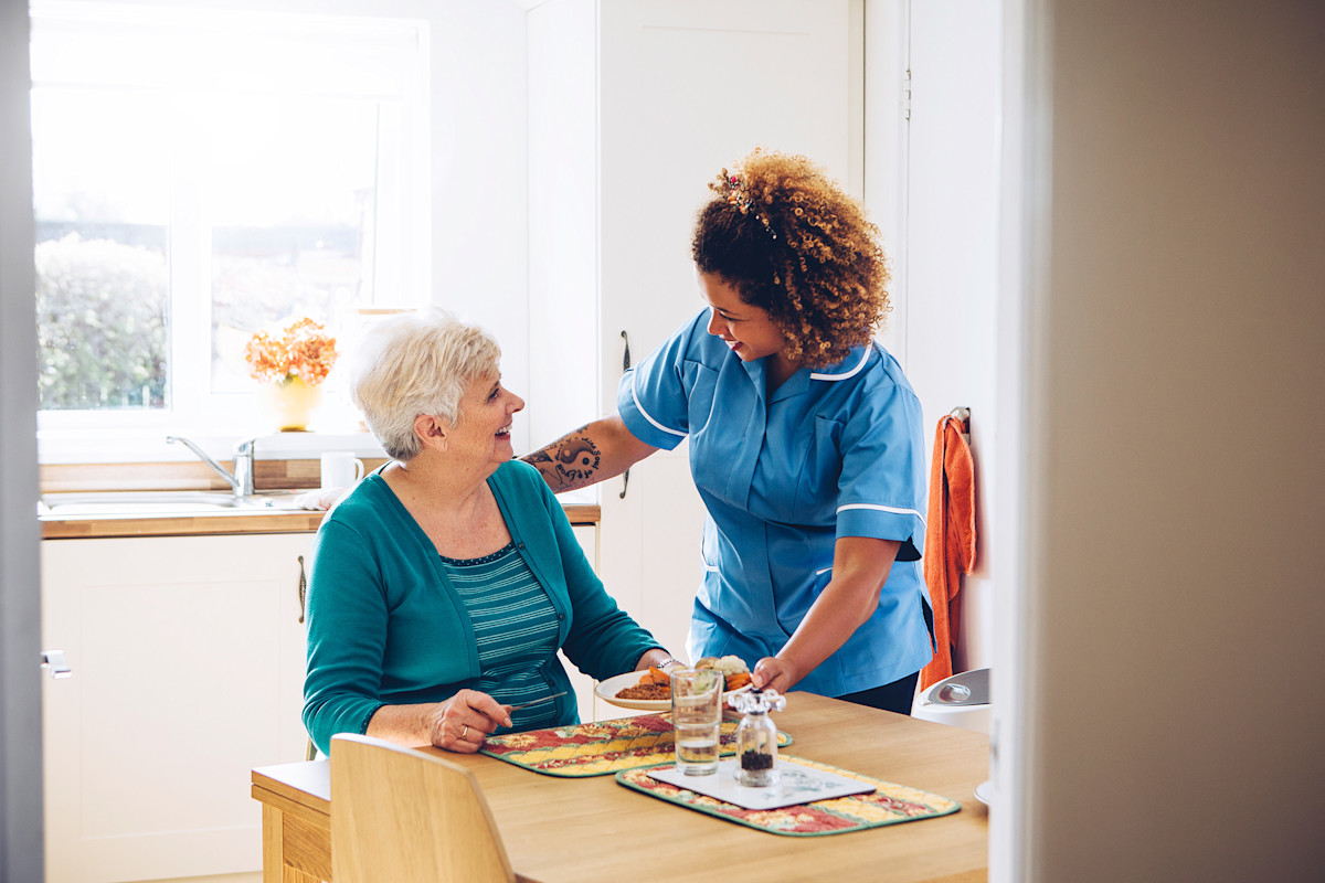 A nurse talking with a patient
