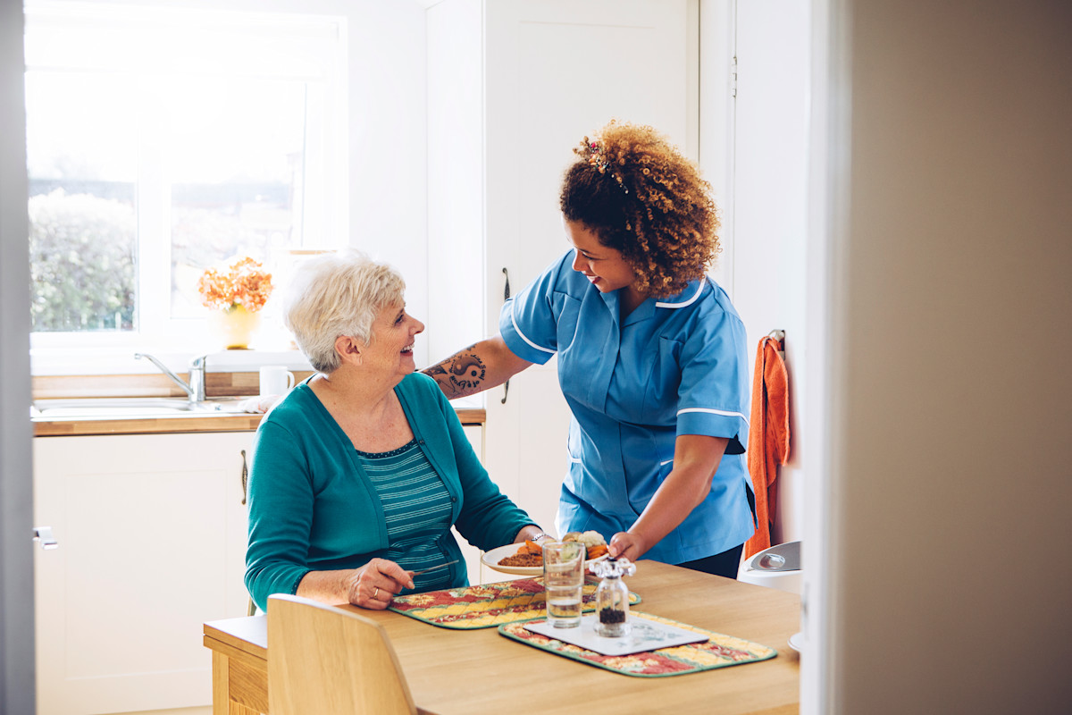 A nurse talking with a patient