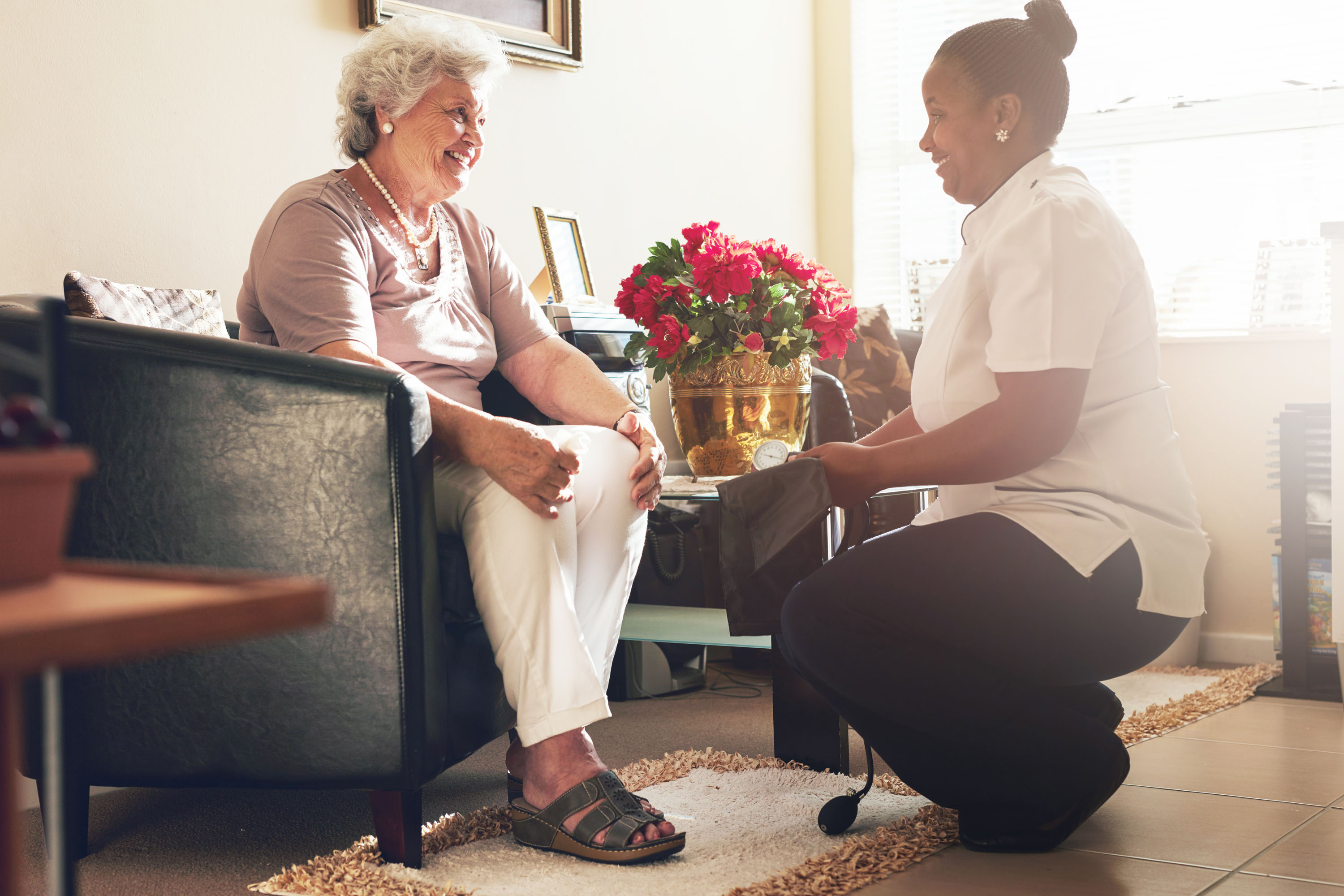 A nurse talking with a woman