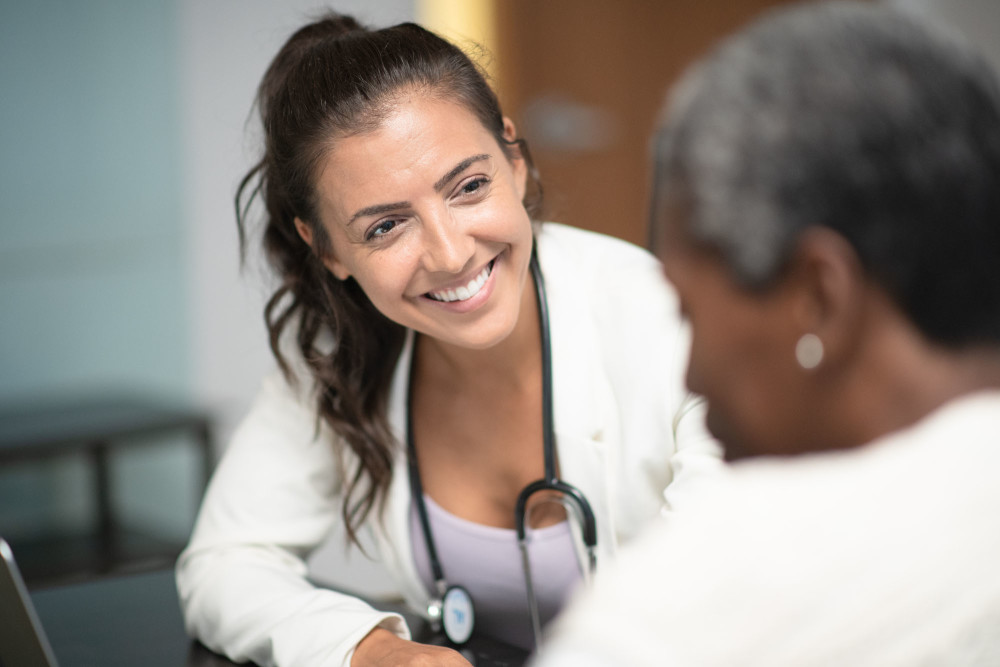 A nurse talking with a patient