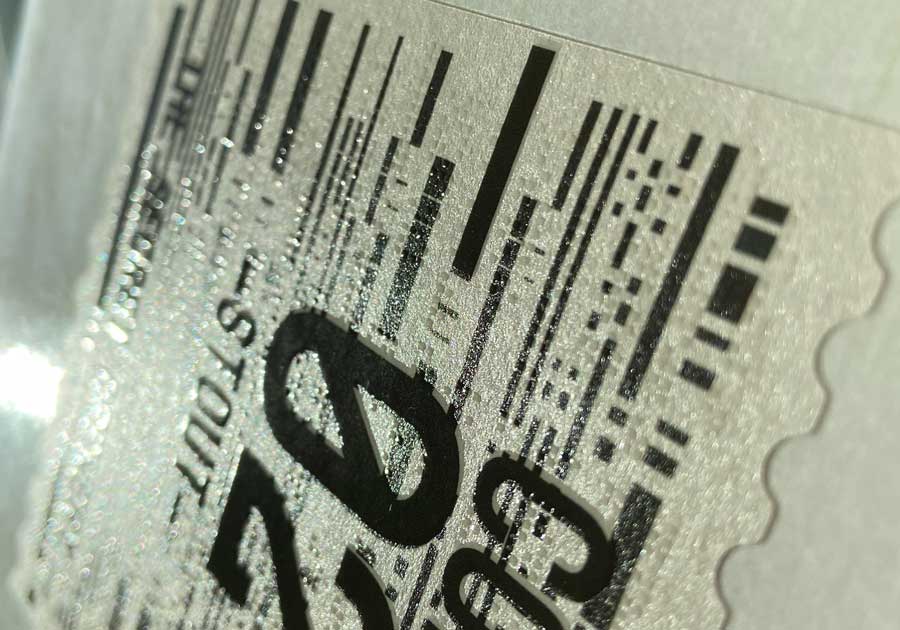 Etiqueta en rollo, aplicación manual estándar, barniz selectivo