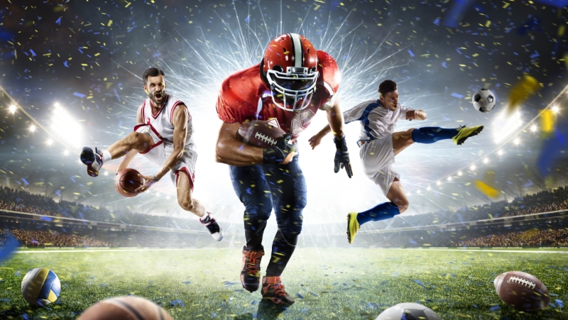 A poster featuring a basketball player, soccer player and football player performing in front of fireworks